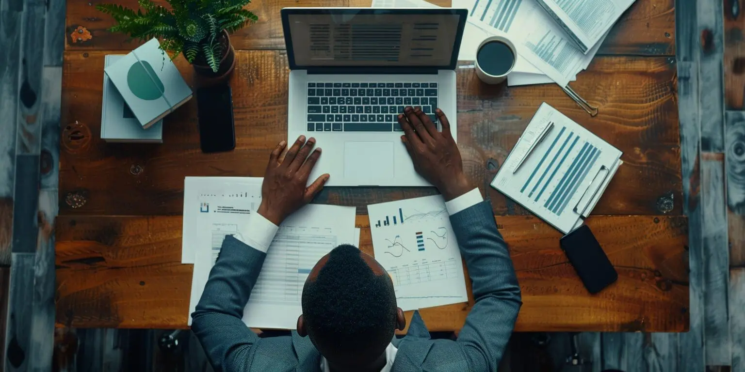 an accountant at a desk using a laptop